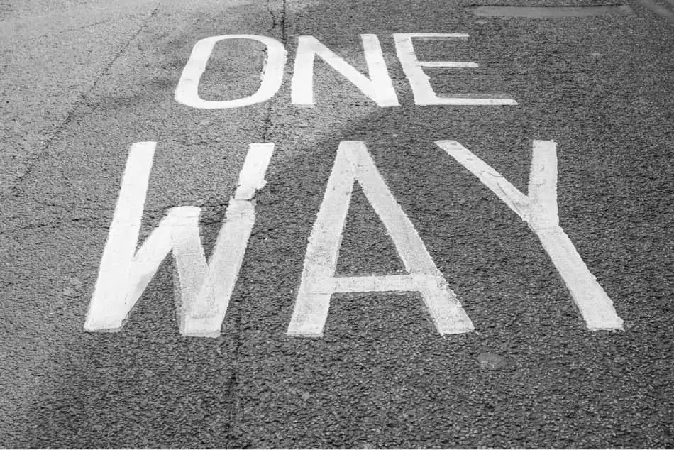 "One way" written on road