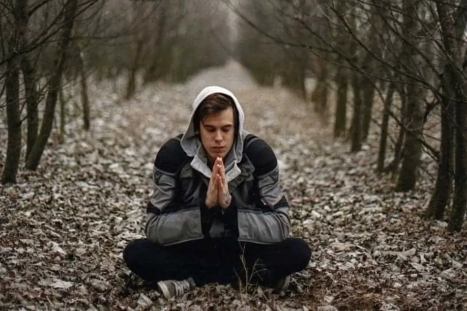 Man praying woods 