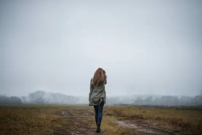 lady walking in open field